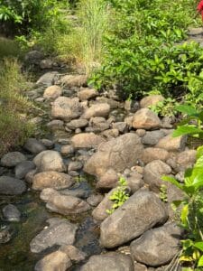 Landscaping rocks controlling soil erosion in garden